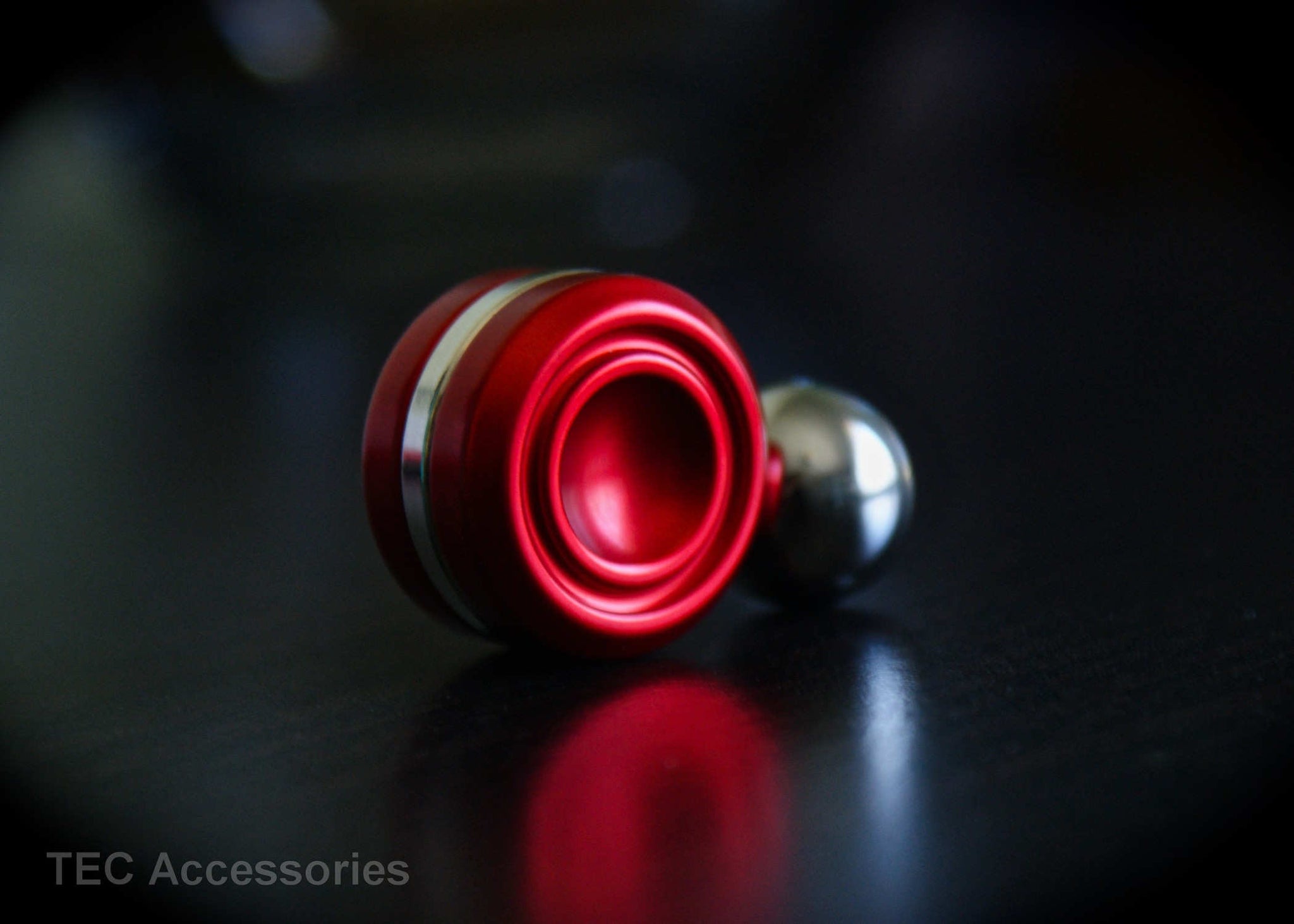 Red Anodized Orbiter LT on Table