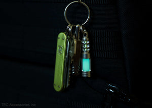 Isotope Chain Reaction Glow Fob on bag